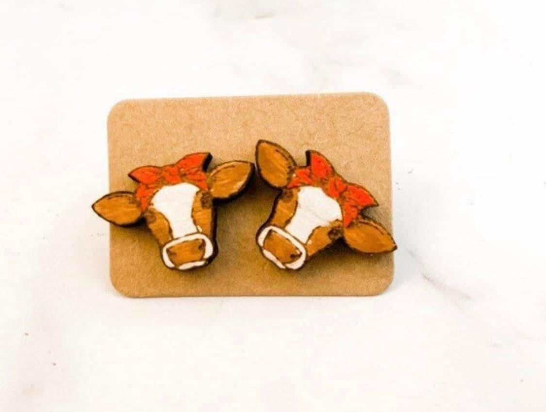 Brown and white cow bow studs